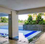 Swimming Pool 3 Comfortable and Big 2BR Bassura City Apartment By Travelio