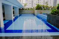Swimming Pool Exclusive and Good 2BR Bassura City Apartment By Travelio