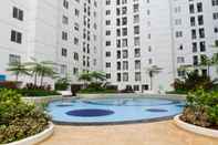 Swimming Pool 2BR Homey and Pleasant Apartment at Bassura City near Mall By Travelio 