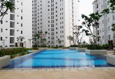 Lobby 4 2BR Homey and Pleasant Apartment at Bassura City near Mall By Travelio 
