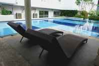 Swimming Pool Compact Homey 2BR Bassura City Apartment By Travelio