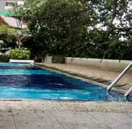 Swimming Pool 5 Compact Homey 2BR Bassura City Apartment By Travelio