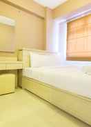 BEDROOM Homey and Easy Access to Mall 2BR Green Pramuka Apartment By Travelio