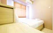 Bedroom 2 Homey and Easy Access to Mall 2BR Green Pramuka Apartment By Travelio