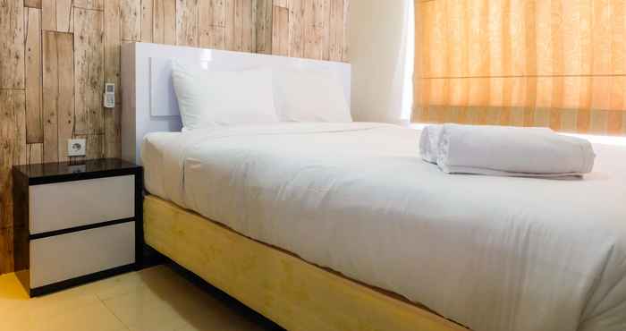 Bedroom Modern Living 2BR with City View at Bassura Apartment By Travelio