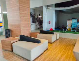 Lobby 2 Comfy Studio Apartment at Tamansari Mahogany By Travelio