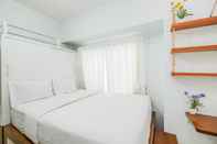 Kamar Tidur Comfy Studio Apartment at Tamansari Mahogany By Travelio