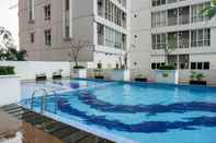 Swimming Pool Studio Apartment near Universitas Indonesia at Taman Melati Margonda By Travelio