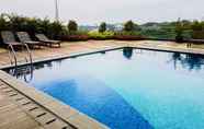 Swimming Pool 4 Cozy and Spacious 1BR at Tree Park Apartment By Travelio