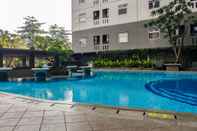 Kolam Renang Modern Design 2BR at Green Pramuka City Apartment By Travelio
