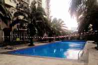 Swimming Pool Homey and Classic 1BR @ Mutiara Bekasi Apartment By Travelio