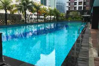 Swimming Pool 4 Homey and Best 2BR Tamansari Semanggi Apartment By Travelio