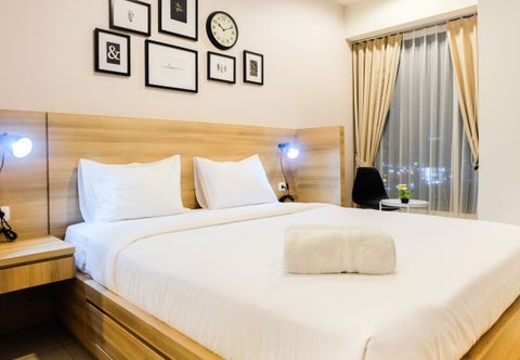 Bedroom Elegant and Modern Studio Grand Kamala Lagoon Apartment By Travelio