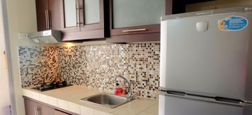 Common Space 5 Enjoyable 2BR Apartment at Mediterania Marina Residence By Travelio