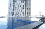 Swimming Pool 5 Marvell City Mall Access 1BR at The Linden Apartment By Travelio