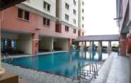 Swimming Pool 2 Simply Design 2BR Gajah Mada Mediterania Apartment By Travelio