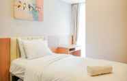 Bedroom 2 Deluxe 2BR at The Branz Apartment near AEON Mall By Travelio