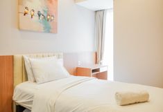 Bedroom 2 Deluxe 2BR at The Branz Apartment near AEON Mall By Travelio
