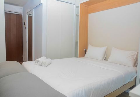 침실 Great Studio with Wall Bed Tifolia Apartment By Travelio