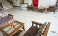 Lobby 5 Comfy Living Studio Apartment at Tamansari Panoramic By Travelio