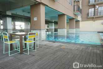 Swimming Pool 4 Comfy Living Studio Apartment at Tamansari Panoramic By Travelio
