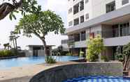 Swimming Pool 4 Elegant Studio Apartment at Parkland Avenue By Travelio