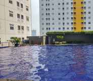 Swimming Pool 3 Studio with Mall Access at Green Pramuka Apartment By Travelio