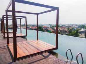 Swimming Pool 4 Stylish and Cozy 1BR at Grand Kamala Lagoon Apartment By Travelio