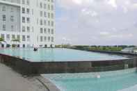 Swimming Pool Minimalist Studio Apartment near Bekasi Station Patraland Urbano By Travelio