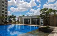 Swimming Pool 5 Simply Modern 1BR at M-Town Signature Apartment By Travelio