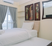 Bedroom 2 Comfy Studio at Tifolia Apartment with City View By Travelio