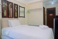 Bedroom Comfy Studio at Tifolia Apartment with City View By Travelio