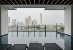 Swimming Pool 4 Elegant and Cozy 2BR Apartment at Kebayoran Icon By Travelio