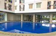 Kolam Renang 4 Minimalist 2BR at Green Park View Apartment By Travelio