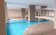 Kolam Renang 6 Minimalist 2BR at Green Park View Apartment By Travelio