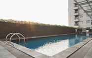 Swimming Pool 3 Comfy Living Studio Apartment at Belmont Residence By Travelio