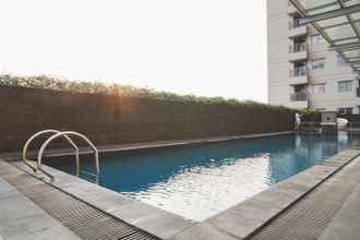 Swimming Pool 4 Comfy Living Studio Apartment at Belmont Residence By Travelio