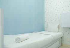 Bedroom 2 Modern and Cozy 2BR Green Pramuka Apartment By Travelio