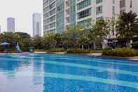 Swimming Pool Stylish 1BR with Workspace at Setiabudi Skygarden Apartment By Travelio