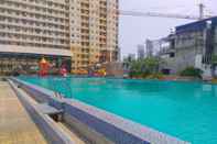 Swimming Pool River View 2BR at Teluk Intan Apartment By Travelio