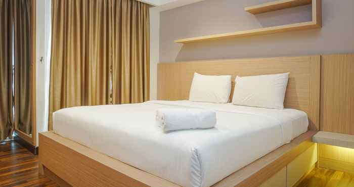 Kamar Tidur Cozy and Stylish 1BR Tamansari The Hive Apartment By Travelio