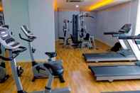Fitness Center Minimalist Design 2BR Apartment at Bassura City near Shopping Mall By Travelio