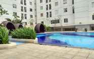 Swimming Pool 4 Relax Living 2BR at Bassura City Apartment By Travelio