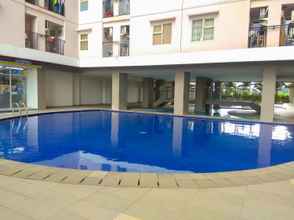 Swimming Pool 4 New Furnished 1BR at Green Park View Apartment By Travelio