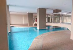 Kolam Renang 4 New Furnished 1BR at Green Park View Apartment By Travelio