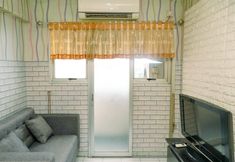 Lobby 2 Cozy 2BR Apartment at Sentra Timur Residence Apartment By Travelio