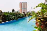 Swimming Pool Cozy 2BR Apartment with Garden View at Tuscany Residences By Travelio