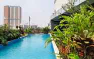 Swimming Pool 5 Cozy 2BR Apartment with Garden View at Tuscany Residences By Travelio