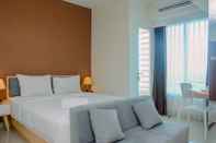 Bedroom Modern Style Studio at Grand Kamala Lagoon Apartment By Travelio