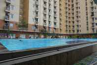 Swimming Pool Duri Kosambi Relaxing 3BR Apartment at Green Palm Residence By Travelio